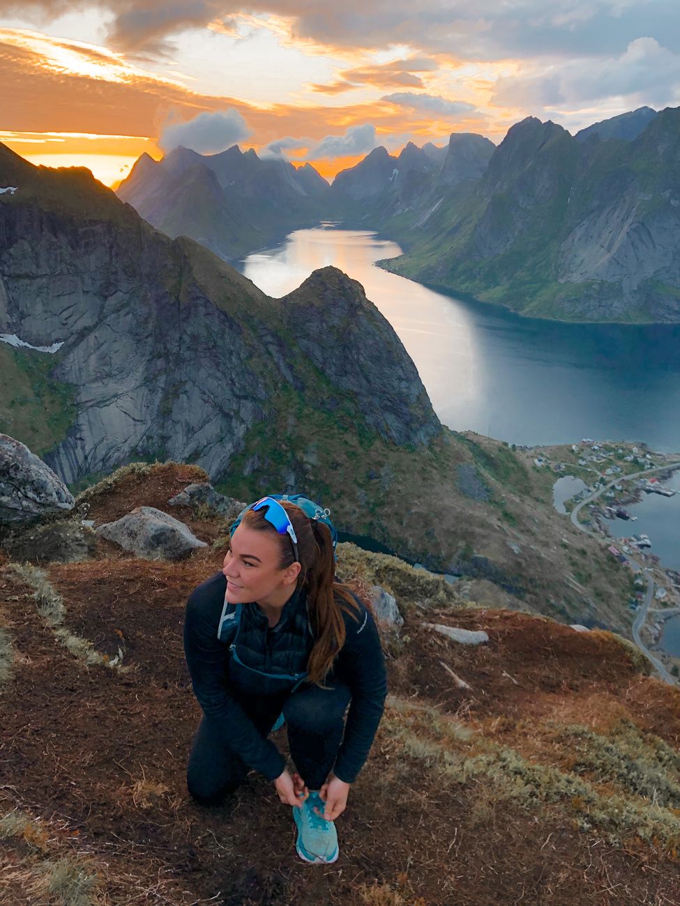 Hiker looking out over panoramic fjord valley